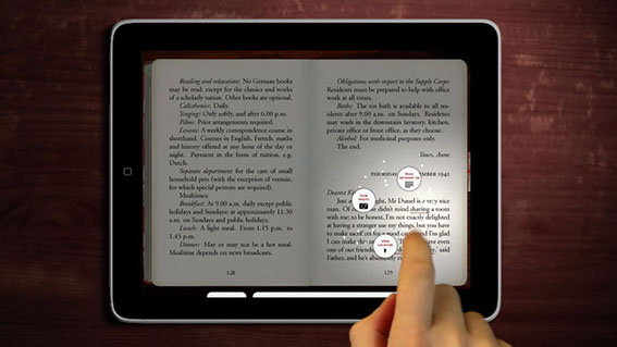Here a finger is tapping on a highlighted word in the Diary.  The page darkens as the background content options swirl around the reader's finge